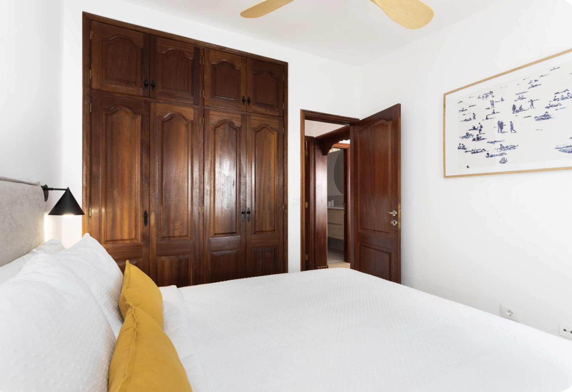 Spacious, well-lit bedroom with comfortable beds, soft neutral tones, clean modern decor, peaceful atmosphere for restful sleep