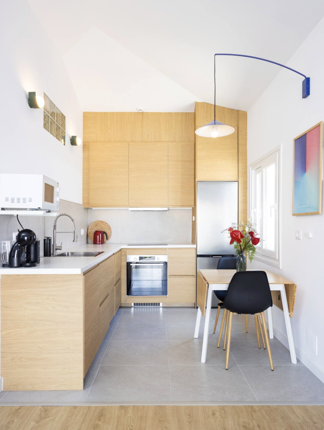 Fully equipped modern kitchen with stainless steel appliances, ample counter space, complete cookware and utensils for meal preparation