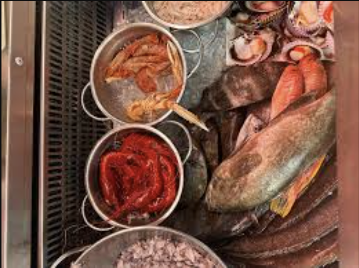 Waterfront seafood restaurants in Tajao with boats moored nearby, authentic coastal dining setting overlooking the sea